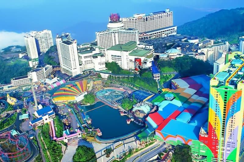 The modern high-altitude cityscape and theme parks of Genting Highlands nestled in the mountain mist