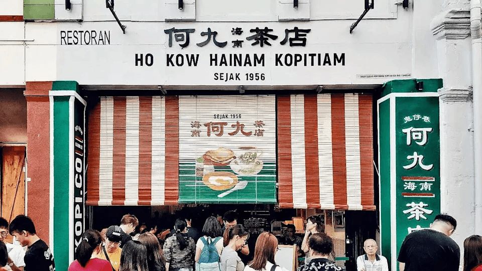 Vibrant heritage facade and traditional breakfast spread at Ho Kow Hainan Kopitiam Kuala Lumpur