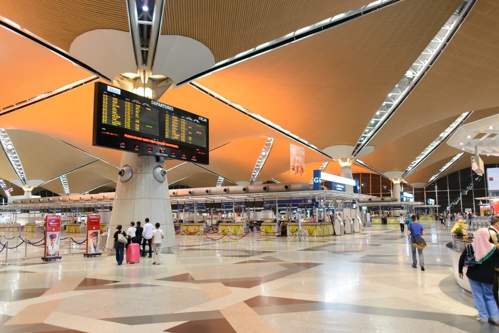 Modern digitized immigration checkpoints and airport arrivals terminal layout in Malaysia